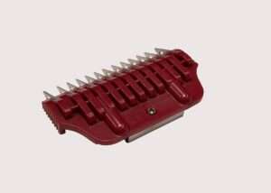 Red plastic hair clipper attachment guard.