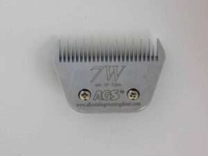 Metal clipper blade attachment on white background.