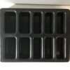 Cast iron cornbread stick pan on white background.