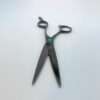 Professional hairdressing scissors on white background.