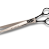 Professional hairdressing scissors on white background.
