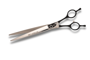 Professional hairdressing scissors on white background.