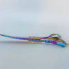 Colorful iridescent hairdressing scissors on white background.