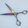 Iridescent professional hairdressing scissors on white background.
