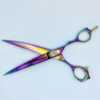 Colorful professional hairdressing shears on white background.