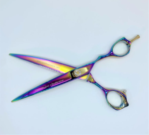 Colorful professional hairdressing shears on white background.
