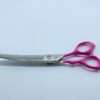 Stainless steel scissors with pink handles on white background.