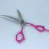 Pink-handled stainless steel scissors on white background.