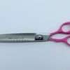 Pro-Line scissors with pink handles on white background.
