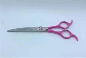 Pink-handled hair cutting scissors.