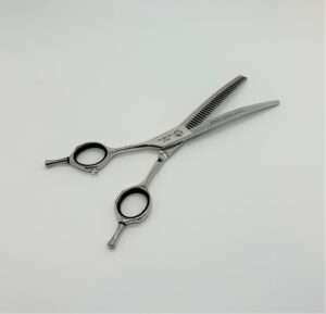 Professional thinning scissors on white background.