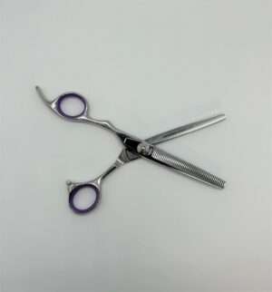 Hair cutting thinning scissors on white background.