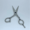 Jeweled hairdressing scissors on white background.