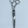 Decorative hairdressing scissors on white background.