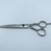 Professional hairdressing scissors on white background.