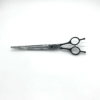 Professional hairdressing scissors on white background.