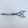 Professional hair thinning scissors on white background