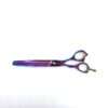 Iridescent hair thinning scissors on white background.