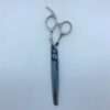 Professional hair thinning scissors on white background.