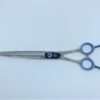 Professional hair cutting scissors with blue handles.