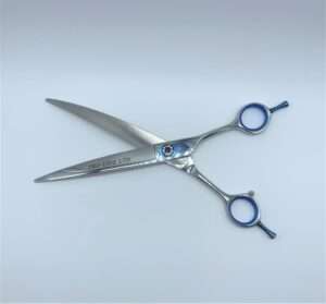 Professional hair cutting scissors on white background.