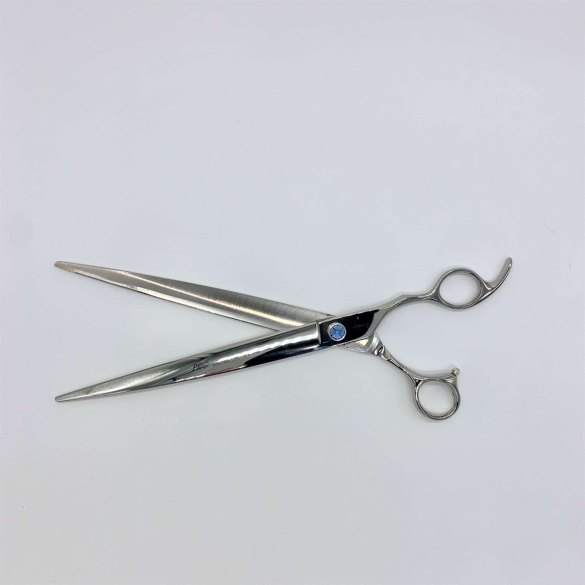 Silver hairdressing scissors on white background