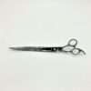 Long professional hairdressing scissors on white background