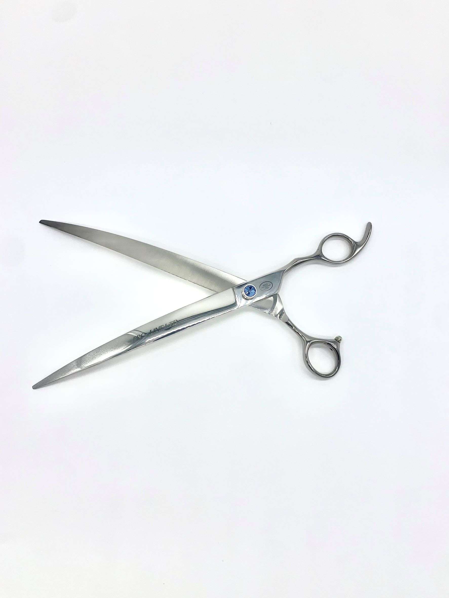 Professional hair cutting scissors on white background.
