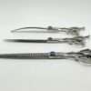 Stainless steel surgical instruments on white background.
