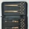 Professional hairdressing scissors set in case.