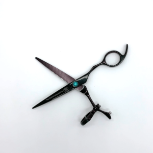 Professional hairdressing scissors on white background.