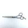 Professional hairdressing scissors on white background