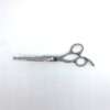 Professional silver hairdressing scissors on white background.