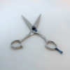 Stainless steel scissors on a white background.