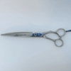 Professional hairdressing scissors on white background.