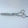 Silver hair thinning scissors on white background.