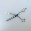 Thinning scissors on white background.