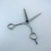 Silver hair thinning scissors on white background