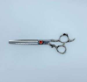 Professional hairstyling thinning scissors on white background.