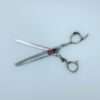 Professional hairdressing thinning scissors on white background