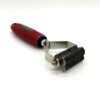 Peeler with red handle on white background.