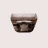 Electric hair clipper on neutral background.