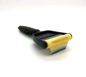 Black and yellow pet grooming brush.
