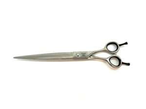Professional hairdressing scissors on white background.