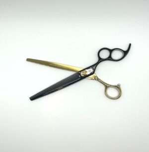 Professional hair thinning scissors on white background.