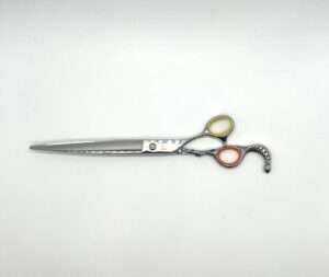 Professional hairdressing scissors on white background.