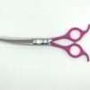 Professional purple hairdressing scissors on white background.