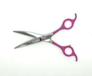 Stainless steel hairdressing scissors with pink accents.
