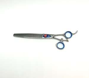 Professional barber thinning scissors on white background.