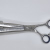 Professional hair thinning shears on white background.